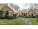 Charming single-story home with lush landscaping and a welcoming front entrance at 4751 Bill Cheek Rd, Auburn, GA 30011