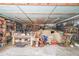 Spacious garage features built-in shelving and ample workspace; perfect for hobbies or storage at 4751 Bill Cheek Rd, Auburn, GA 30011