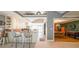 Kitchen with breakfast bar, island, and view into dining room at 4751 Bill Cheek Rd, Auburn, GA 30011