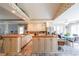 Open kitchen with light cabinets, island, and eat-in dining area at 4751 Bill Cheek Rd, Auburn, GA 30011