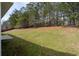 Expansive backyard with lush greenery, offering ample space for outdoor activities and relaxation at 7178 Cavender Sw Dr, Atlanta, GA 30331