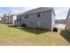 View of a large backyard with a patio area perfect for outdoor gatherings at 7178 Cavender Sw Dr, Atlanta, GA 30331