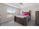 Inviting bedroom with a tray ceiling and a well-lit window at 7178 Cavender Sw Dr, Atlanta, GA 30331
