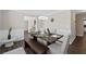 Charming dining room featuring a stylish table with bench seating and modern decor at 7178 Cavender Sw Dr, Atlanta, GA 30331