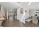 Open concept entryway with wood floors, leading to the living room and dining room at 7178 Cavender Sw Dr, Atlanta, GA 30331