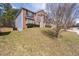A brick two-story house featuring a well-maintained lawn and blue siding accents at 7178 Cavender Sw Dr, Atlanta, GA 30331
