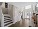 Bright foyer boasts high ceilings, hardwood floors, and a staircase at 7178 Cavender Sw Dr, Atlanta, GA 30331