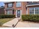 Up close view of a home's front door, complemented by manicured bushes and walkway at 7178 Cavender Sw Dr, Atlanta, GA 30331