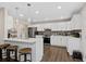 Beautiful kitchen with white cabinets, a large island, and modern pendant lighting at 7178 Cavender Sw Dr, Atlanta, GA 30331