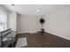 Inviting living room with wood floors, bench seating, and natural light at 7178 Cavender Sw Dr, Atlanta, GA 30331