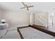 Inviting living room features a ceiling fan, wooden floors, and staircase access at 7178 Cavender Sw Dr, Atlanta, GA 30331