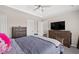 Comfortable main bedroom with tray ceiling and two large dressers at 7178 Cavender Sw Dr, Atlanta, GA 30331