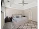 Spacious main bedroom with tray ceilings, carpeted floors, a fan, and natural light at 7178 Cavender Sw Dr, Atlanta, GA 30331