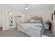 Spacious main bedroom features a full bed, neutral carpet, and ceiling fan at 7178 Cavender Sw Dr, Atlanta, GA 30331