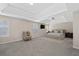 Spacious main bedroom with tray ceilings, carpeted floors, and natural light, creating a tranquil sanctuary at 7178 Cavender Sw Dr, Atlanta, GA 30331