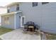 Cozy patio area features a grill and table, perfect for outdoor dining at 7178 Cavender Sw Dr, Atlanta, GA 30331