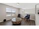 Upstairs sitting area with stylish furniture and hardwood floors at 7178 Cavender Sw Dr, Atlanta, GA 30331