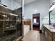 Bathroom featuring a glass shower door, a soaking tub, and a dual sink vanity at 2702 Brookefield Nw Ln, Kennesaw, GA 30152
