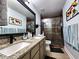 Bathroom featuring a dual vanity sink with a granite countertop and a walk-in shower at 2702 Brookefield Nw Ln, Kennesaw, GA 30152