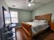 Bedroom featuring wood floors, a window, a ceiling fan, and neutral paint at 2702 Brookefield Nw Ln, Kennesaw, GA 30152