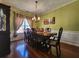 Inviting dining room with hardwood floors, stylish chandelier, and ample seating for elegant dinners and entertaining guests at 2702 Brookefield Nw Ln, Kennesaw, GA 30152