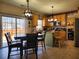 Bright kitchen with an island, stainless appliances, tile floors, and access to the backyard, ideal for cooking at 2702 Brookefield Nw Ln, Kennesaw, GA 30152