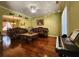 Elegant living room with hardwood floors, decorative ceiling fan, and ample space for comfortable seating and entertaining at 2702 Brookefield Nw Ln, Kennesaw, GA 30152