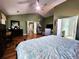 Spacious main bedroom featuring an ensuite bathroom, a vaulted ceiling, and hardwood flooring at 2702 Brookefield Nw Ln, Kennesaw, GA 30152