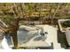 Aerial view of the house with a gray roof, chimney, fenced yard, and a shed with chairs on top at 633 N Fairfield Dr, Peachtree City, GA 30269