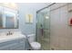 Bathroom featuring a glass shower, modern vanity, and tiled flooring at 633 N Fairfield Dr, Peachtree City, GA 30269
