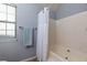 Bathroom features a soaking tub and shower combination, with a gray accent wall at 633 N Fairfield Dr, Peachtree City, GA 30269