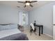 Bedroom features plush carpet, a ceiling fan, and a modern desk at 633 N Fairfield Dr, Peachtree City, GA 30269