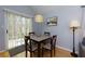 Cozy dining area with a sliding glass door and a modern light fixture at 633 N Fairfield Dr, Peachtree City, GA 30269