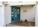 Close-up of the front door with teal trim and a decorative address number at 633 N Fairfield Dr, Peachtree City, GA 30269