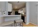 Kitchen with white cabinetry, and a breakfast bar at 633 N Fairfield Dr, Peachtree City, GA 30269