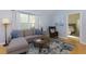 Comfortable living room with a sectional sofa, hardwood floors, and natural light at 633 N Fairfield Dr, Peachtree City, GA 30269