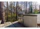 Built-in outdoor grill for BBQ and entertainment, set on a backyard patio overlooking the wooded property at 633 N Fairfield Dr, Peachtree City, GA 30269
