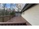 Exterior shot of a wood back deck and screened in porch area at 1027 Goza Rd, Fayetteville, GA 30215