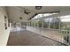 Covered back porch featuring a ceiling fan and scenic views of the surrounding nature at 1027 Goza Rd, Fayetteville, GA 30215