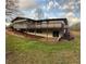 Spacious back yard with a deck, patio, and sliding doors to the basement at 1027 Goza Rd, Fayetteville, GA 30215