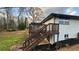 Exterior with a wooden staircase leading to the backyard at 1027 Goza Rd, Fayetteville, GA 30215
