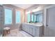 Bright bathroom features double vanity, lots of natural light, and tiled floors at 1116 Heatherland Dr, Marietta, GA 30066