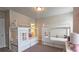 Well-lit bedroom featuring whimsical twin beds and carpet at 1116 Heatherland Dr, Marietta, GA 30066