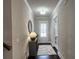 Bright entryway showcasing dark hardwood floors, a console table, and elegant decor at 1116 Heatherland Dr, Marietta, GA 30066