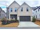 Charming two-story brick home featuring an attached two-car garage and manicured front yard at 1116 Heatherland Dr, Marietta, GA 30066