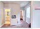Hallway featuring an entry to a bathroom and a view to the outside at 1116 Heatherland Dr, Marietta, GA 30066