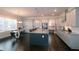 Modern kitchen featuring white cabinets, granite countertops, stainless steel appliances, and a central island at 1116 Heatherland Dr, Marietta, GA 30066