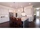 Modern kitchen featuring white cabinets, granite countertops, stainless steel appliances, and a central island at 1116 Heatherland Dr, Marietta, GA 30066