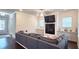 Cozy living room with a fireplace, built-in cabinets, and a comfortable gray sectional sofa at 1116 Heatherland Dr, Marietta, GA 30066