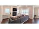 Cozy living room with a fireplace, built-in cabinets, and a comfortable gray sectional sofa at 1116 Heatherland Dr, Marietta, GA 30066